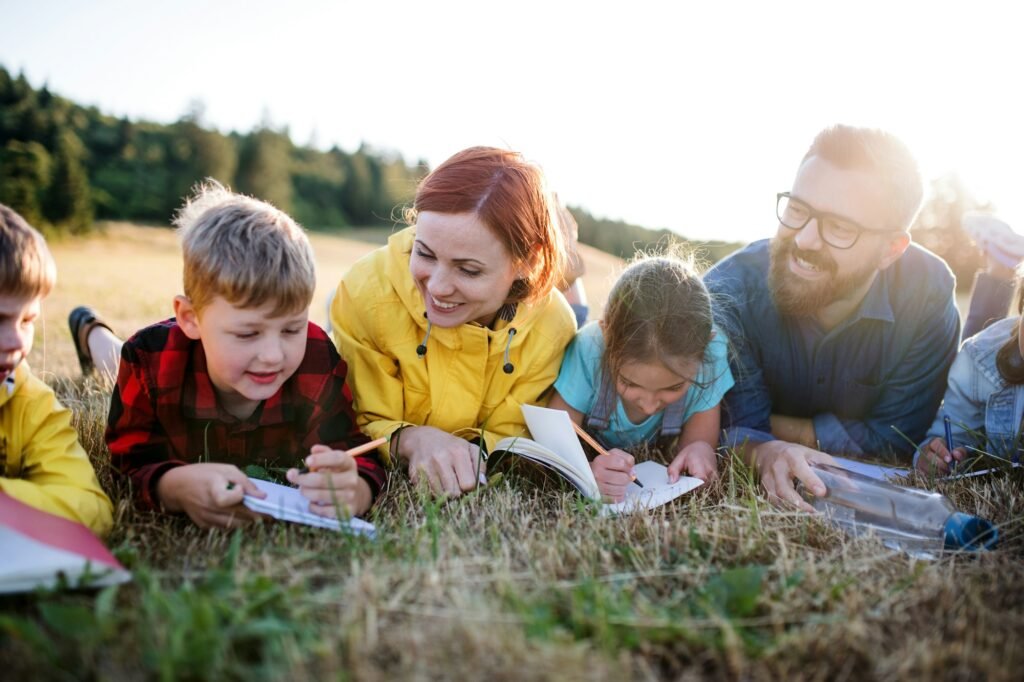 Group of school children with teacher on field trip in nature